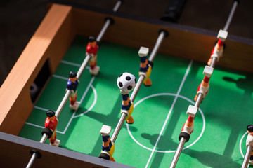 football - board game with players, soccer ball and green field