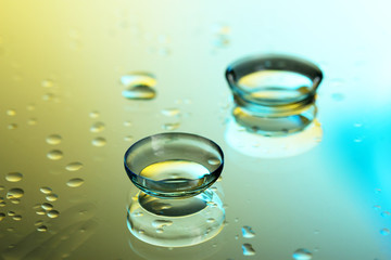 contact lenses, on yellow-blue background