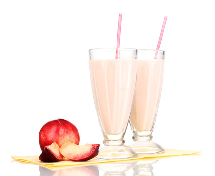 Peach milk shakes isolated on white