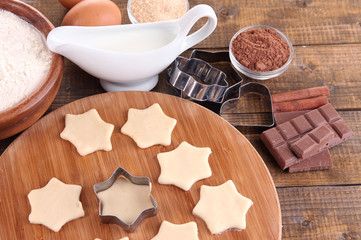 Making cookies on wooden background