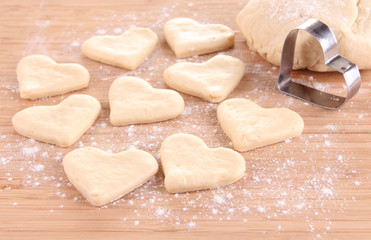 Fototapeta na wymiar Making cookies on wooden background