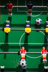 football - board game with players, soccer ball and green field