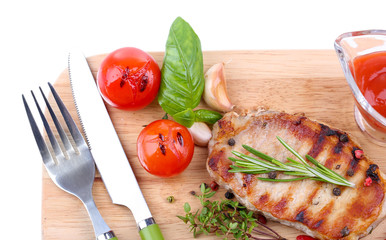 Grilled steak with spices, herbs and vegetables