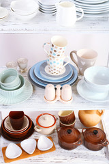 Different tableware on shelf, close up