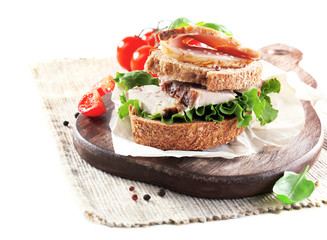 Delicious sandwiches with meet on table close-up