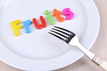 Plate with inscription on table close-up