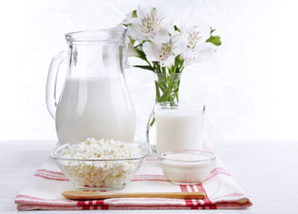 Tasty dairy products on wooden table