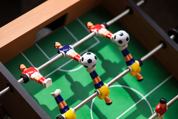 football - board game with players, soccer ball and green field