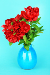 Beautiful pink peonies on blue background