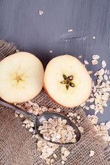Apple with oatmeal and vintage spoon