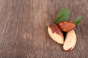 Tasty brasil nuts on wooden background