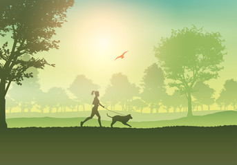 Naklejka na ściany i meble Female jogging with dog in countryside