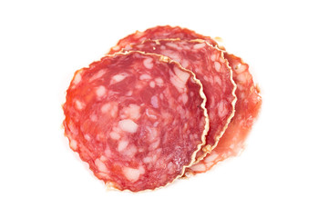 Slices of salami sausage on a white background