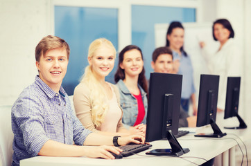 Fototapeta premium students with computer monitor at school