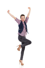 Obraz premium Fashionable girl celebrating success