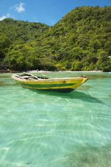Fototapeta na wymiar Haitian Fishing Boat: An old fishing boat near Labadee, Haiti