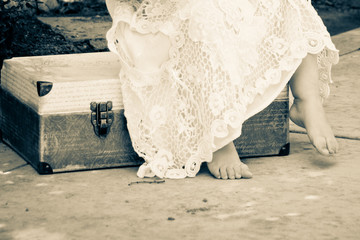 Vintage dress & suitcase with little girl toes