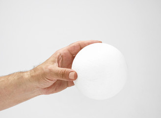 Fototapeta na wymiar Styrofoam ball in hand