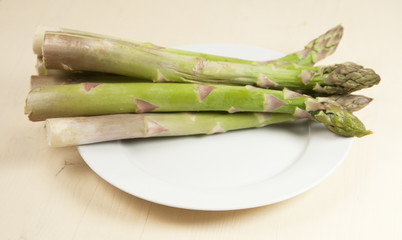 Asparagus on a white plate, side