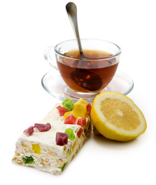 isolated image of cup of tea and cake closeup