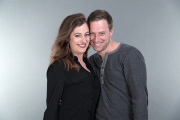 Casual fashion romantic happy couple. Young man and woman. Studi