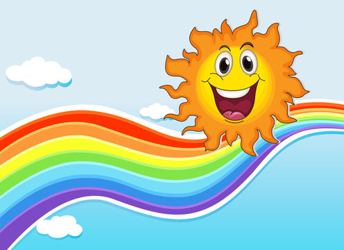 A smiling sun near the rainbow