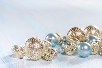 Blue beads on a wooden background closeup