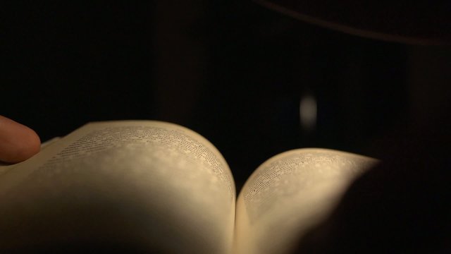 Reading a book at night