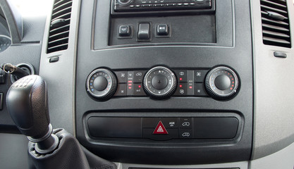 Closeup of air control panel inside of mini passenger bus