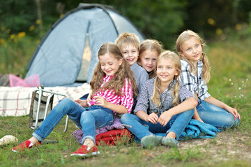 Fototapeta na wymiar Portrait of young children on a camping holiday