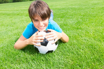 boy holding football ball