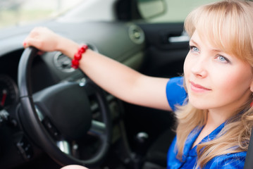Fototapeta na wymiar attractive blonde woman driver
