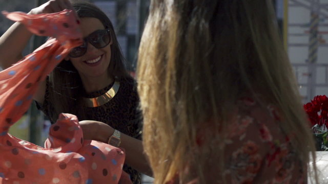 Woman smiling and putting on sarong, slow motion shot at 240fps,