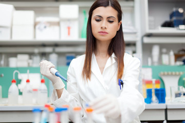 Researcher examining a test tube