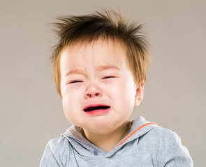 Crying asian baby boy