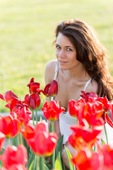 Girl and flower bed with tulips