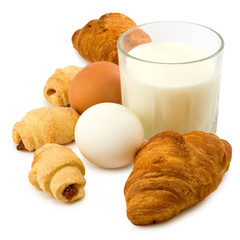 Isolated image of a glass of milk, eggs and cookies closeup