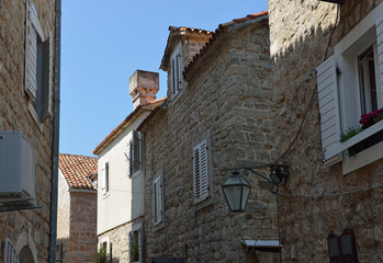 Fototapeta na wymiar View of narrow street in old town in Budva, Montenegro.