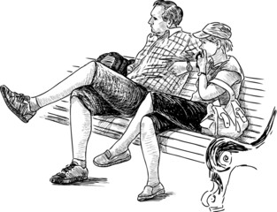 Fototapeta na wymiar couple relaxing on a bench