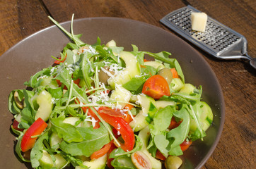 Arugula Salad with tomatoes, olives and parmesan