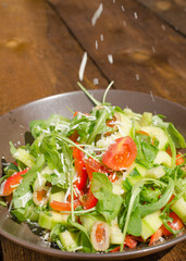 Arugula Salad with tomatoes, olives and parmesan