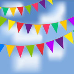 Party flags with blue sky and white clouds