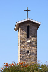 Cross Atop Roof of Bell Tower on Catholic Church