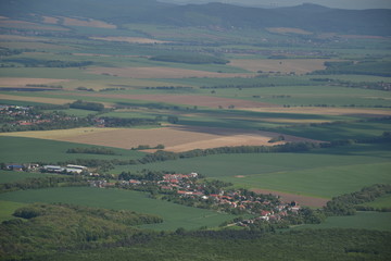 Obraz premium View of trees, mountains, hills, fields and villages from Marhat