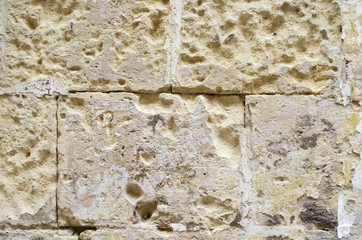 Weathered old sandstone wall background