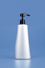 Plastic bottle on blue