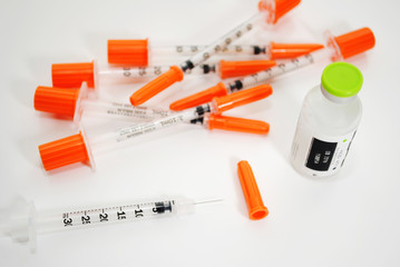 A Vial of Insuline with Disposable Needles