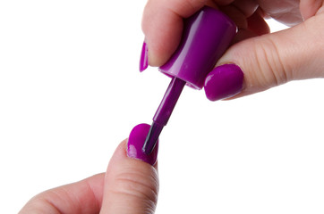 Woman's hand applying nail varnish
