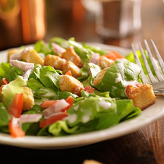 salad with ranch dressing, tomatos, onions, and croutons