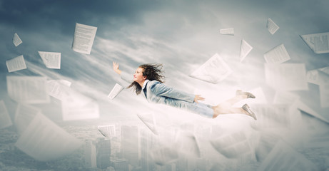 Flying businesswoman